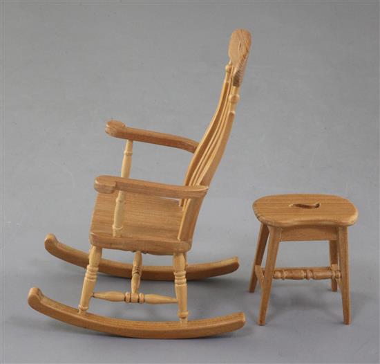 Denis Hillman. A Victorian style beech miniature rocking armchair and matching stool with a saddle shaped seat, height of rocking chair